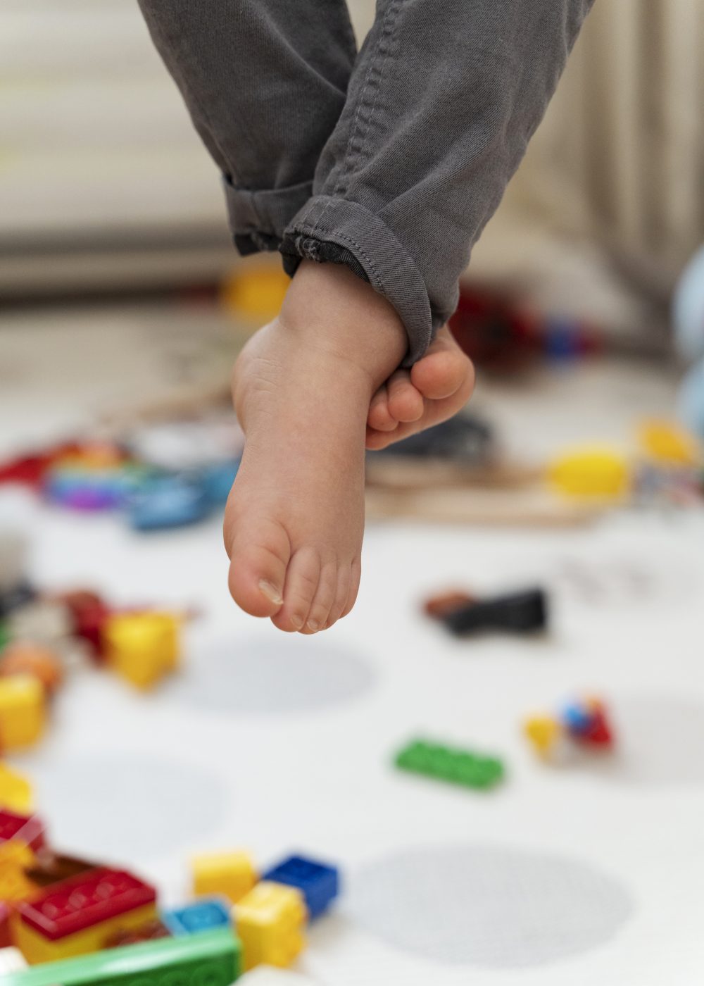 close-up-kid-s-feet-with-blurry-background