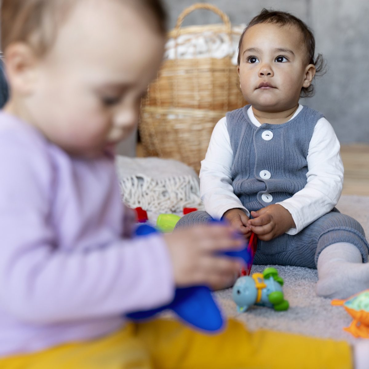 cute-babies-playing-floor-with-toys
